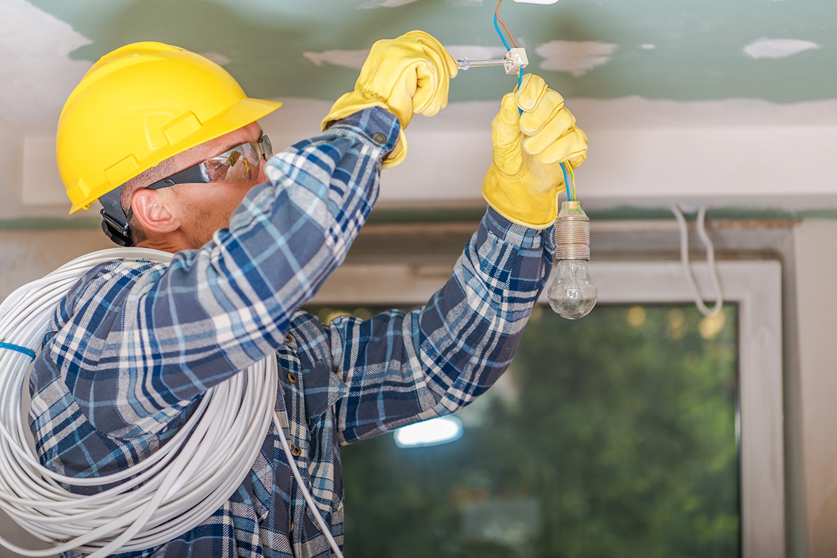 Electrician Apprentice installing a light fixture