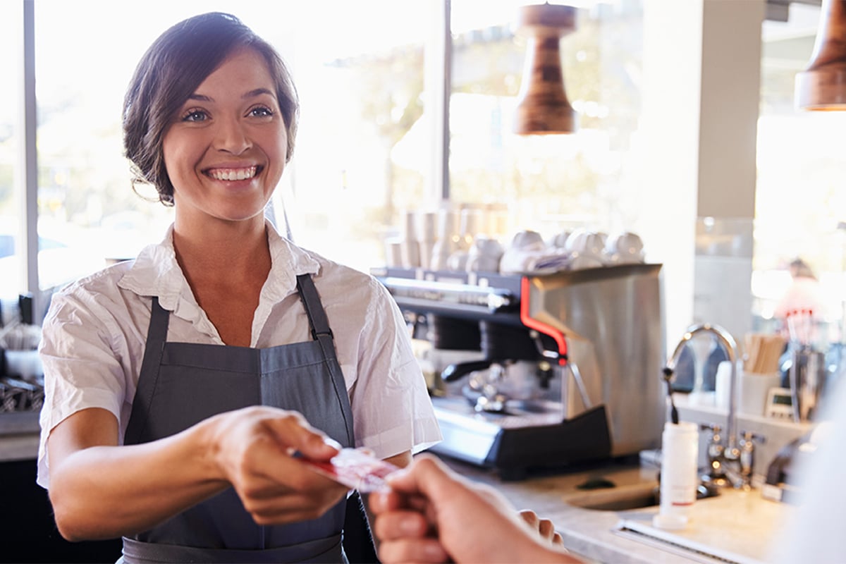 Cashier receiving payment from customer