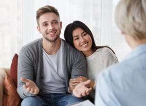 A young couple meeting with a Marriage and Family Therapist