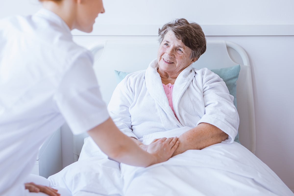 Nursing Assistant caring for an elderly patient
